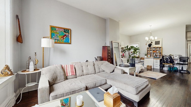 living area with an inviting chandelier and hardwood / wood-style floors