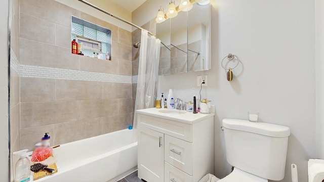 bathroom with toilet, shower / bath combo, and vanity