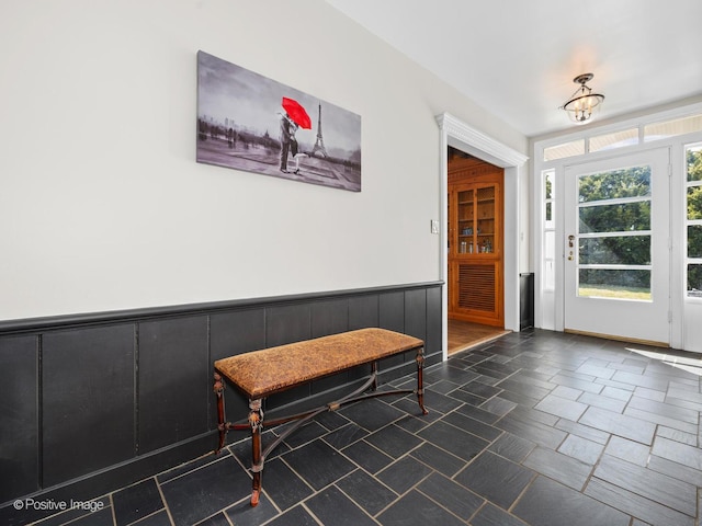 interior space featuring a wainscoted wall