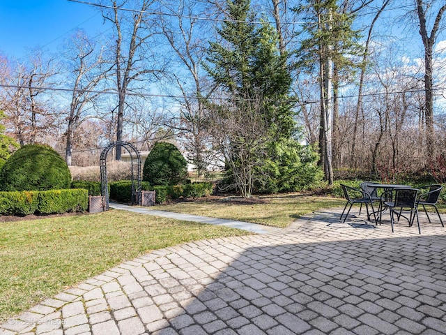 view of patio featuring outdoor dining area
