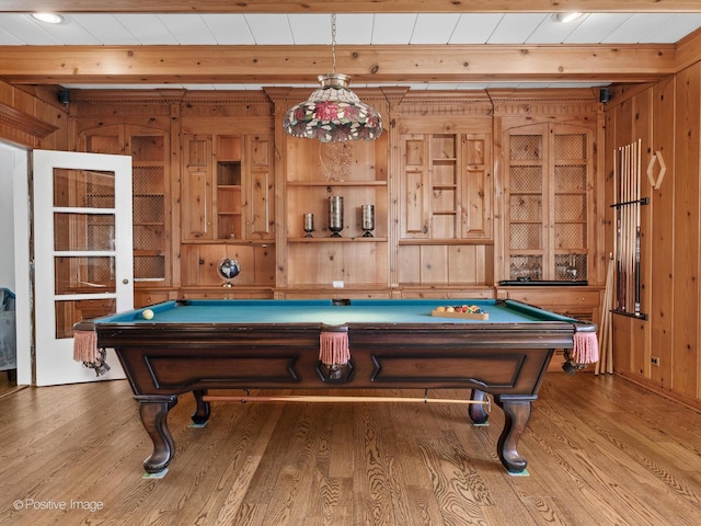 rec room featuring wood walls, billiards, and wood finished floors
