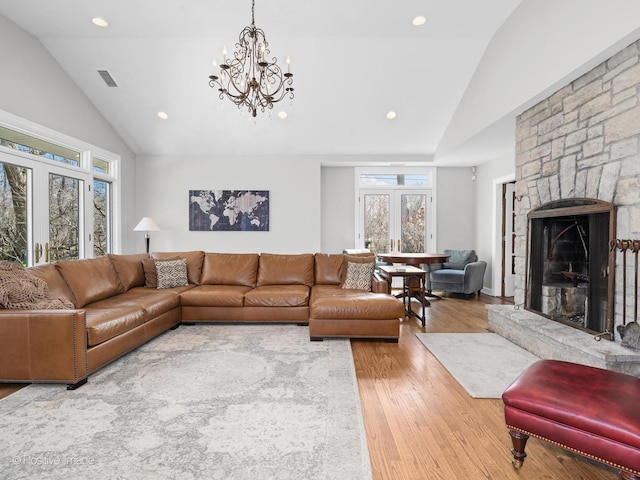 living area featuring recessed lighting, visible vents, and light wood finished floors