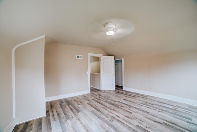 212 E Ash St, Watseka, IL 60970 - spare room with a ceiling fan, wood finished floors, lofted ceiling, and baseboards