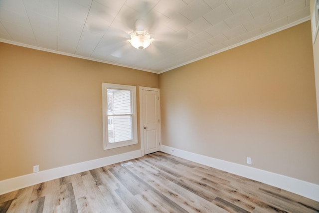 212 E Ash St, Watseka, IL 60970 - unfurnished room featuring ornamental molding, light wood-style floors, and baseboards