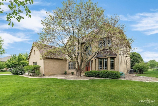 541 Clover Dr, Algonquin, IL 60102 - view of front of home featuring a front yard, central AC unit, and brick siding