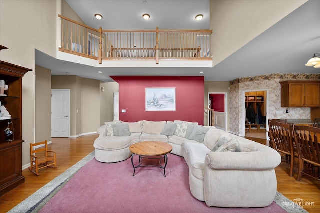 541 Clover Dr, Algonquin, IL 60102 - living area with a high ceiling, light wood-type flooring, and baseboards