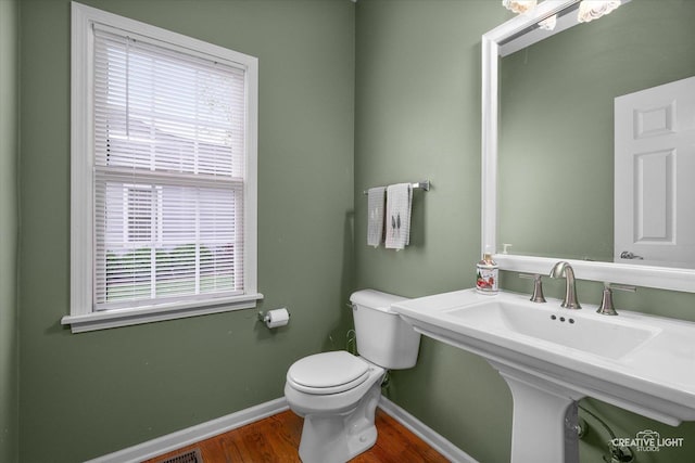541 Clover Dr, Algonquin, IL 60102 - bathroom featuring baseboards, wood finished floors, toilet, and healthy amount of natural light