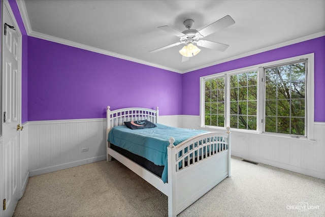 541 Clover Dr, Algonquin, IL 60102 - bedroom with a wainscoted wall, crown molding, carpet, and ceiling fan