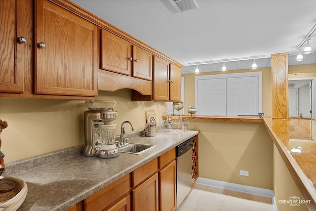 541 Clover Dr, Algonquin, IL 60102 - kitchen featuring a sink, stainless steel dishwasher, rail lighting, and brown cabinetry