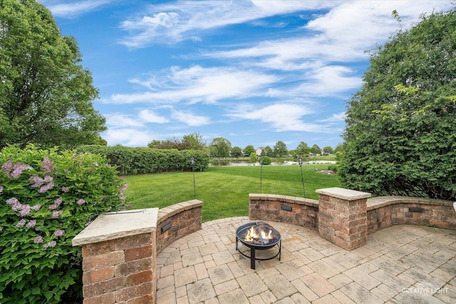 541 Clover Dr, Algonquin, IL 60102 - view of patio featuring an outdoor fire pit and a water view