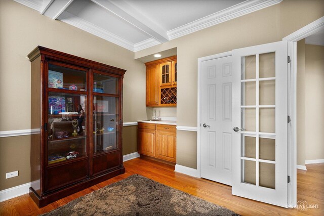 541 Clover Dr, Algonquin, IL 60102 - indoor wet bar with light wood-type flooring, crown molding, and baseboards