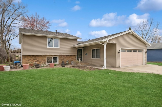 111 E Garden Ave, Palatine, IL 60067 - split level home with a garage, a front yard, brick siding, and concrete driveway
