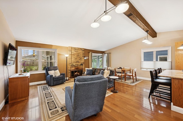 111 E Garden Ave, Palatine, IL 60067 - living room featuring vaulted ceiling with beams, baseboards, light wood-type flooring, and a fireplace
