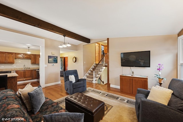 111 E Garden Ave, Palatine, IL 60067 - living area featuring lofted ceiling with beams, baseboards, wood finished floors, and stairs