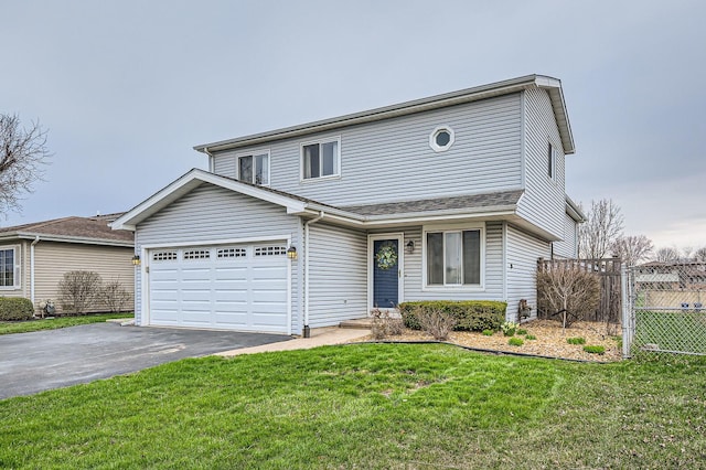 traditional-style house featuring aphalt driveway, fence, an attached garage, and a front yard