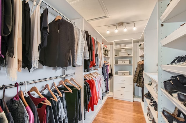 spacious closet with light wood-style floors