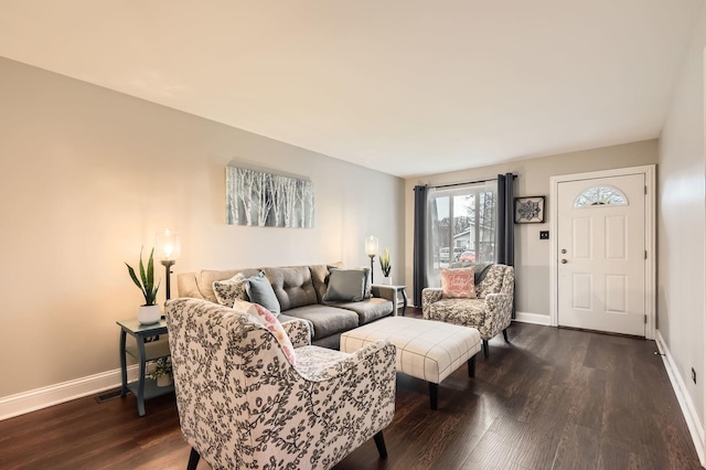 living room featuring dark wood-style flooring and baseboards