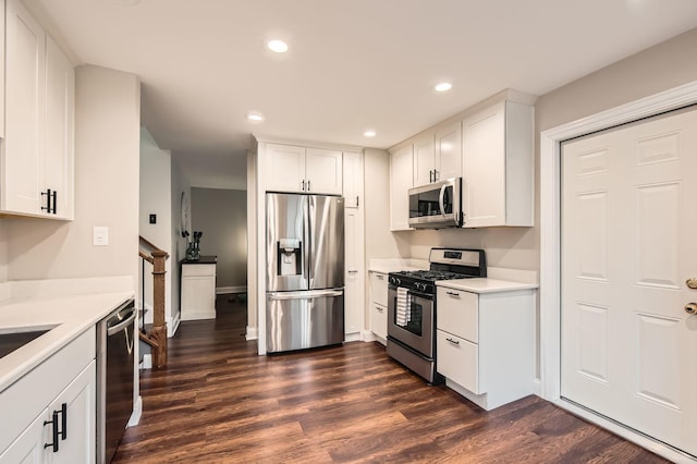kitchen featuring white cabinets, light countertops, dark wood finished floors, recessed lighting, and stainless steel appliances
