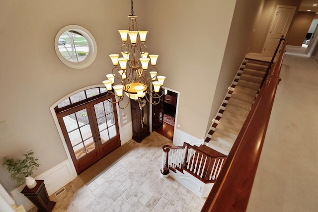 3131 Pepper Creek Bridge Pkwy, Valparaiso, IN 46385 - foyer with french doors, a chandelier, stairway, and a towering ceiling