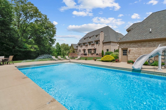 3131 Pepper Creek Bridge Pkwy, Valparaiso, IN 46385 - swimming pool with a water slide and a patio area