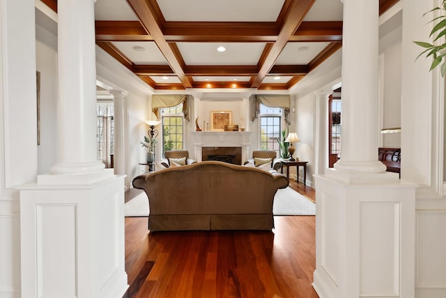 3131 Pepper Creek Bridge Pkwy, Valparaiso, IN 46385 - living area with ornate columns, dark wood-style floors, beam ceiling, coffered ceiling, and a fireplace