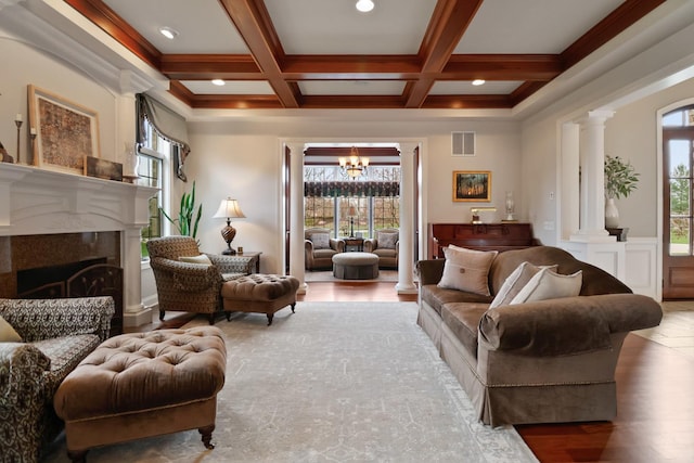 3131 Pepper Creek Bridge Pkwy, Valparaiso, IN 46385 - living room featuring plenty of natural light, a chandelier, ornate columns, beam ceiling, and coffered ceiling