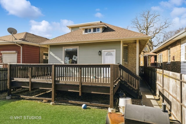 7427 S Bennett Ave, Chicago, IL 60649 - back of house featuring brick siding, roof with shingles, a deck, and fence