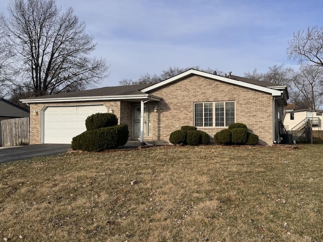 16426 Homan Ave, Markham, IL 60428 - ranch-style home with aphalt driveway, fence, brick siding, a garage, and central AC unit