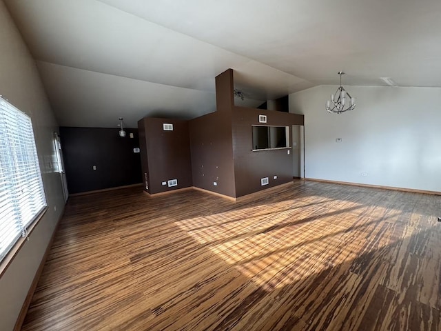 16426 Homan Ave, Markham, IL 60428 - unfurnished room with visible vents, baseboards, an inviting chandelier, wood finished floors, and lofted ceiling