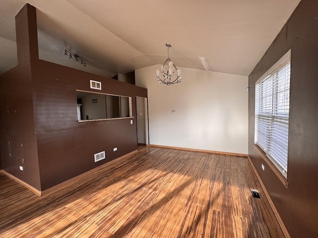 16426 Homan Ave, Markham, IL 60428 - empty room with visible vents, an inviting chandelier, and wood finished floors