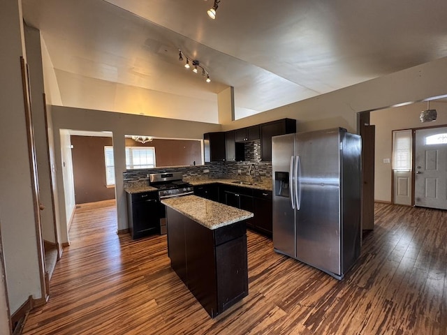 16426 Homan Ave, Markham, IL 60428 - kitchen featuring tasteful backsplash, dark wood finished floors, stainless steel appliances, a kitchen island, and light stone counters