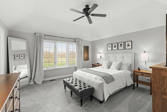 carpeted bedroom featuring ceiling fan, baseboards, and vaulted ceiling