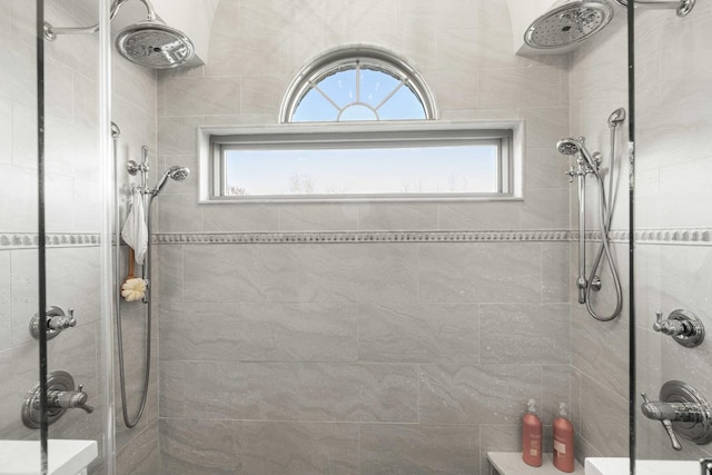full bath with tiled shower