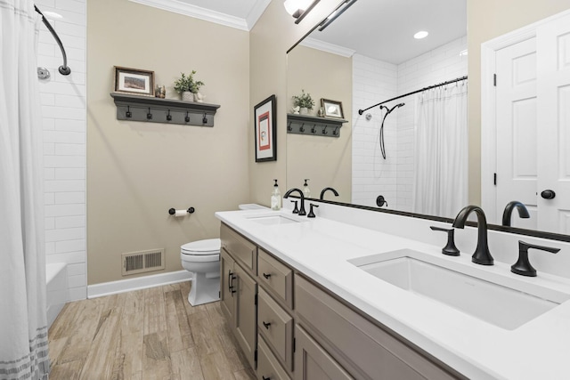 full bathroom with toilet, a sink, ornamental molding, and visible vents