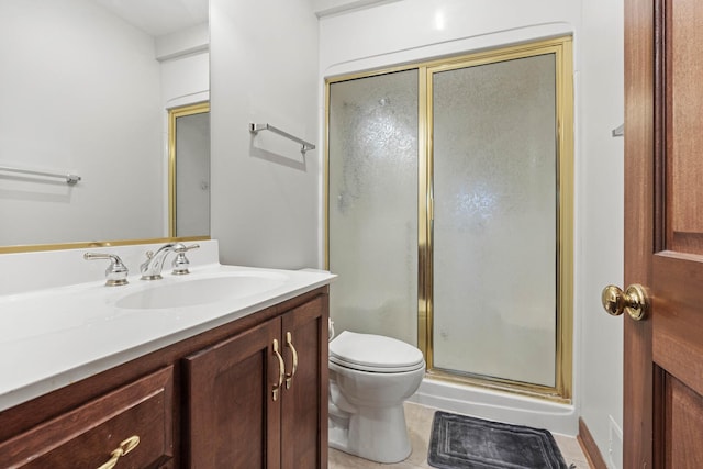 bathroom featuring a shower stall, vanity, and toilet