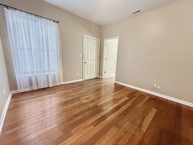 4731 S Ingleside Ave Unit C3, Chicago, IL 60615 - unfurnished room featuring hardwood / wood-style floors, baseboards, and visible vents