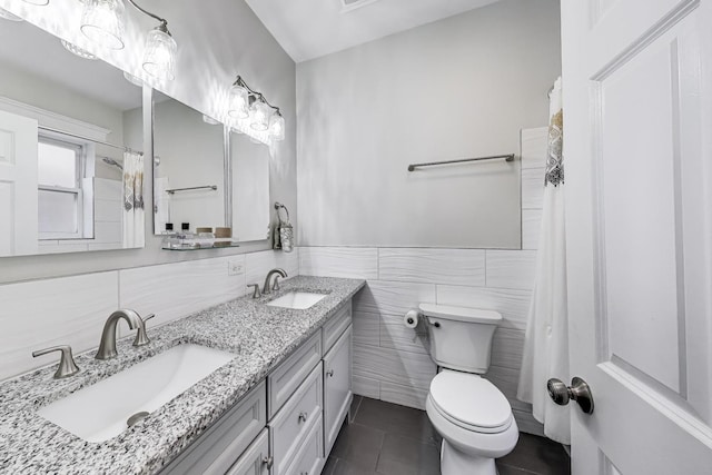 834 W Belle Plaine Ave Unit 3W, Chicago, IL 60613 - full bathroom featuring tile patterned flooring, tile walls, a sink, and toilet