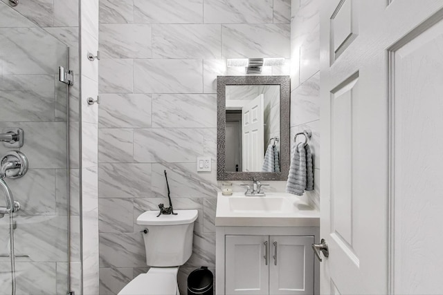 834 W Belle Plaine Ave Unit 3W, Chicago, IL 60613 - bathroom featuring a shower stall, tile walls, vanity, and toilet