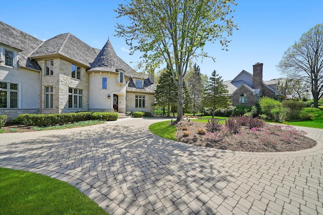 96 S Wynstone Dr, North Barrington, IL 60010 - view of front of home featuring a high end roof, stone siding, and curved driveway