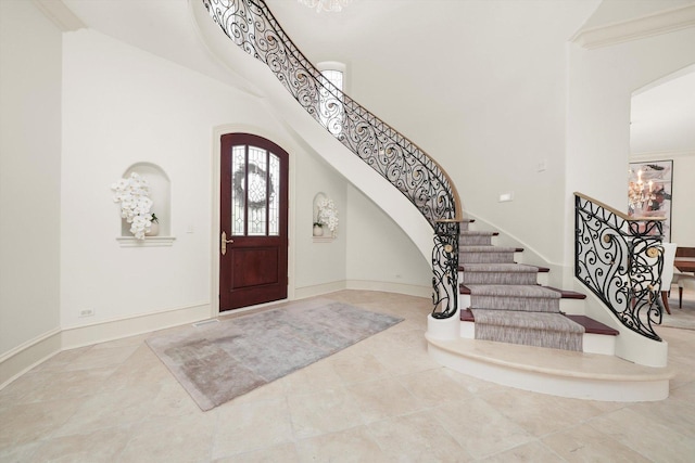 96 S Wynstone Dr, North Barrington, IL 60010 - tiled entryway featuring a high ceiling, arched walkways, and stairway