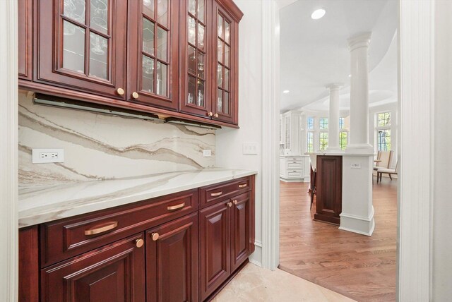 96 S Wynstone Dr, North Barrington, IL 60010 - bar area with ornate columns, light wood-style flooring, recessed lighting, and tasteful backsplash