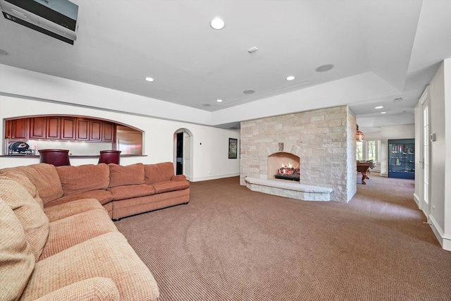 96 S Wynstone Dr, North Barrington, IL 60010 - carpeted living area with recessed lighting, a stone fireplace, and arched walkways