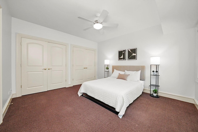 96 S Wynstone Dr, North Barrington, IL 60010 - bedroom with dark colored carpet, two closets, and a ceiling fan