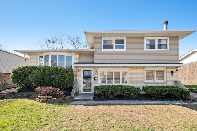 7709 161st St, Tinley Park, IL 60477 - tri-level home featuring a front yard and brick siding