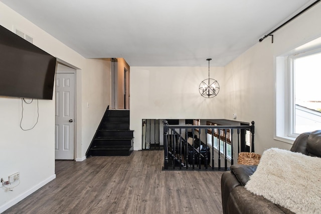7709 161st St, Tinley Park, IL 60477 - living room featuring baseboards, a chandelier, and wood finished floors