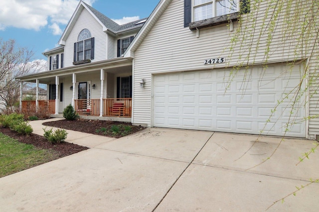 traditional home with covered porch and concrete driveway