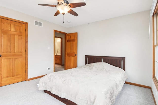 bedroom with visible vents, carpet flooring, and baseboards