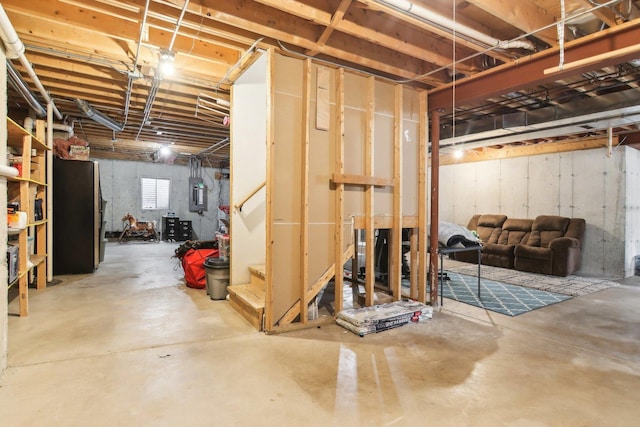 basement with electric panel and stairway