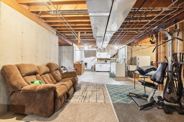 unfinished basement with independent washer and dryer