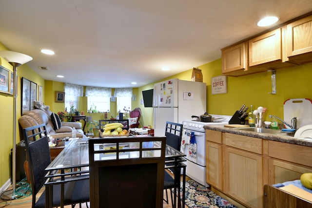 kitchen with visible vents, a sink, open floor plan, electric stove, and recessed lighting